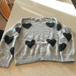 Grey sweater with black hearts. Size L